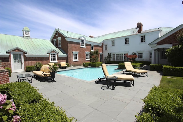 pool with a patio area