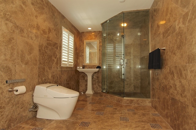 bathroom with toilet, tile walls, tile patterned flooring, and a stall shower