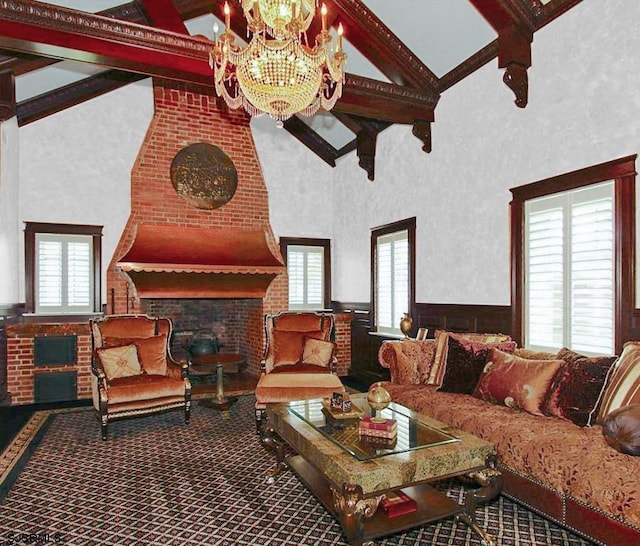 interior space with plenty of natural light, an inviting chandelier, high vaulted ceiling, and beamed ceiling