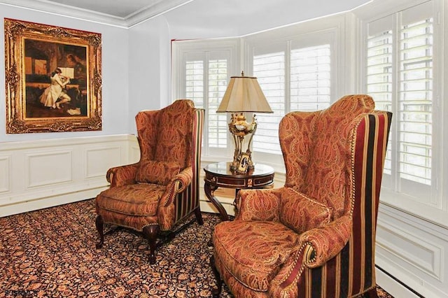 sitting room featuring a baseboard radiator and ornamental molding