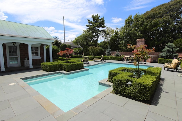 pool featuring a patio area