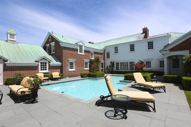 pool with a patio
