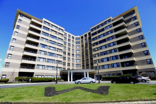 view of property featuring uncovered parking