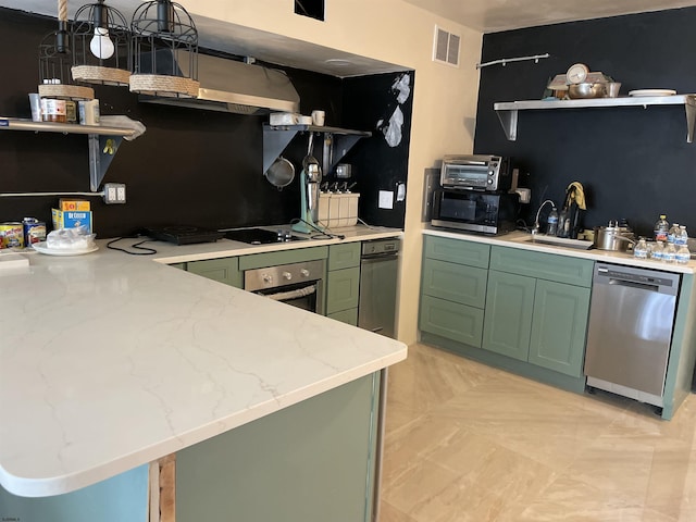 kitchen with visible vents, open shelves, a sink, green cabinets, and stainless steel appliances