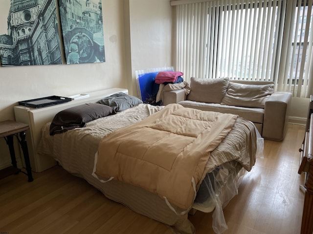 bedroom with light wood-type flooring
