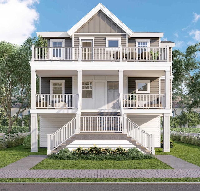 view of front facade with board and batten siding, a balcony, and covered porch