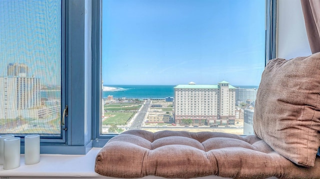 interior space featuring a water view and a city view