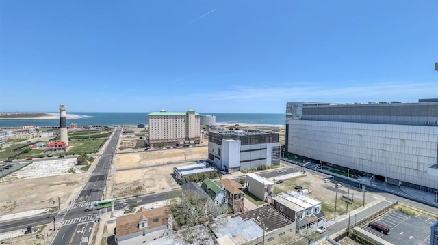 drone / aerial view featuring a water view and a city view