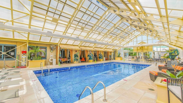 pool with a patio and outdoor dining space