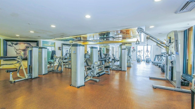 gym with visible vents, recessed lighting, and a wealth of natural light