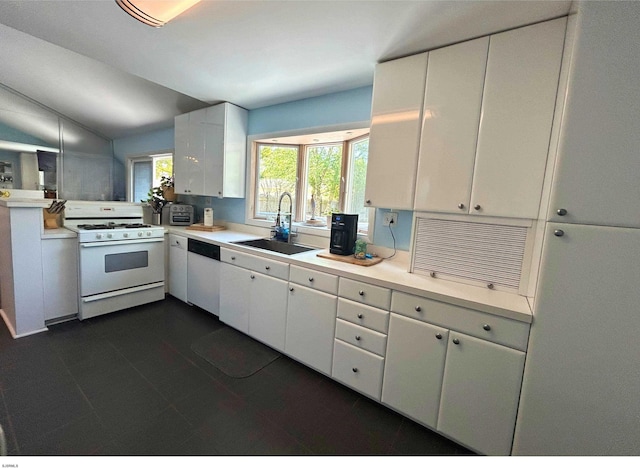 306 W Revere Ave, Northfield, NJ 08225 - kitchen featuring white appliances, a sink, light countertops, white cabinetry, and lofted ceiling