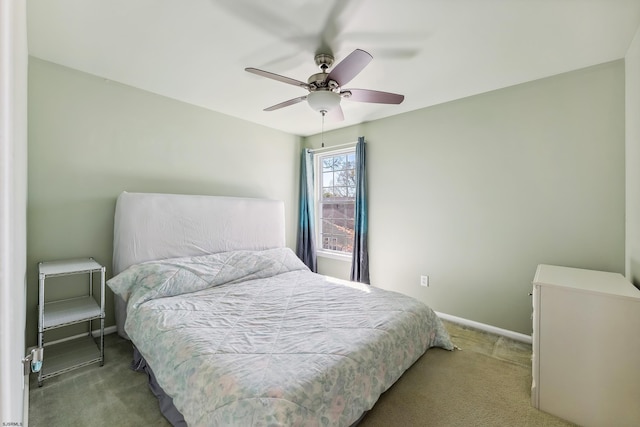 bedroom featuring carpet flooring, a ceiling fan, and baseboards