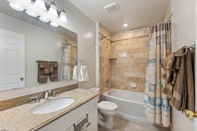 bathroom featuring shower / bath combination with curtain, visible vents, tile patterned flooring, vanity, and toilet