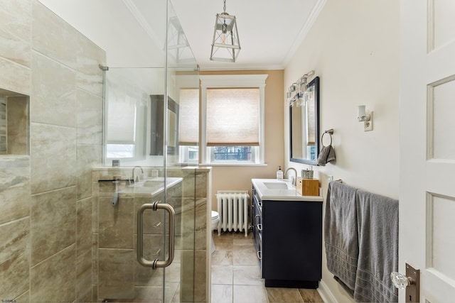 full bath featuring vanity, ornamental molding, toilet, radiator heating unit, and a shower stall