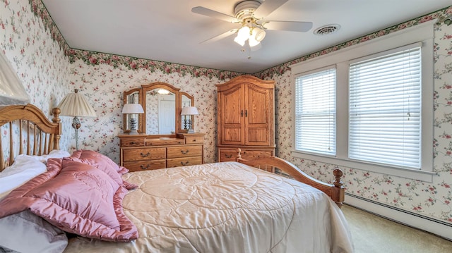bedroom with carpet floors, baseboard heating, wallpapered walls, and visible vents