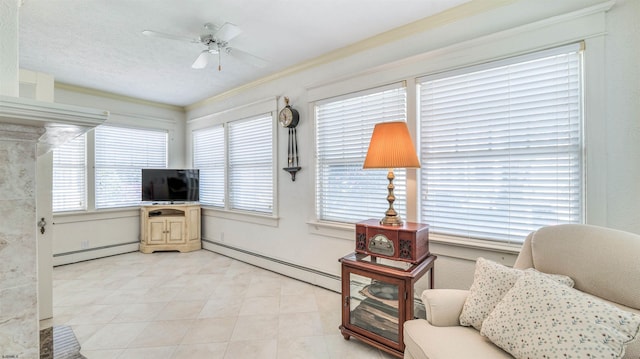 sitting room with crown molding, light tile patterned flooring, ceiling fan, and baseboard heating