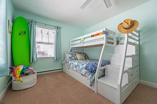 bedroom featuring carpet flooring, a textured ceiling, ceiling fan, and baseboard heating