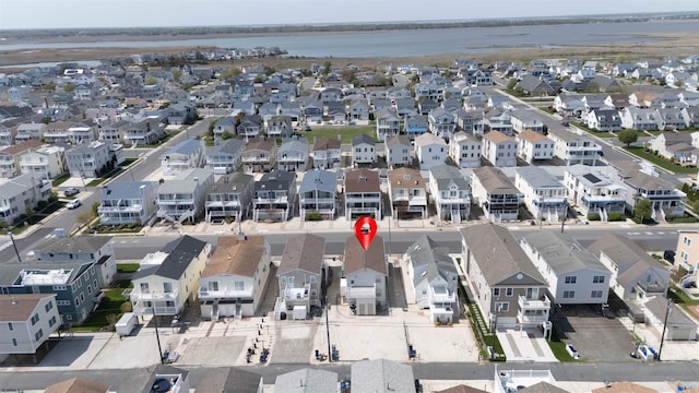 aerial view featuring a water view and a residential view