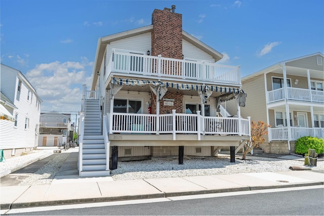view of front of home featuring stairway
