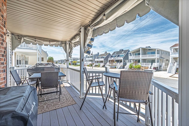 wooden deck with a residential view