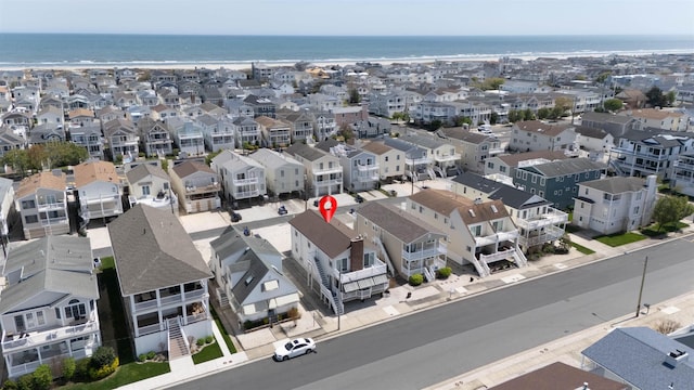birds eye view of property with a residential view and a water view