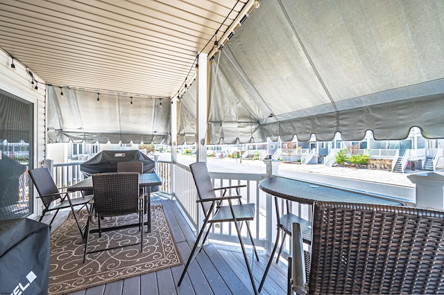 wooden deck with grilling area