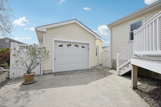 detached garage with concrete driveway