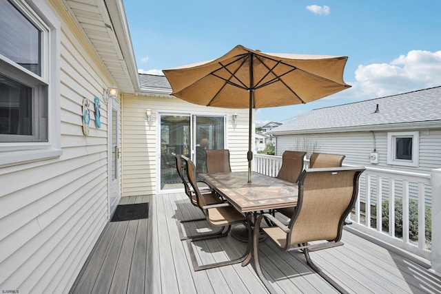 wooden terrace with outdoor dining space
