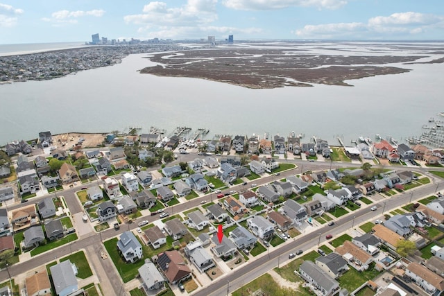 aerial view with a water view and a residential view