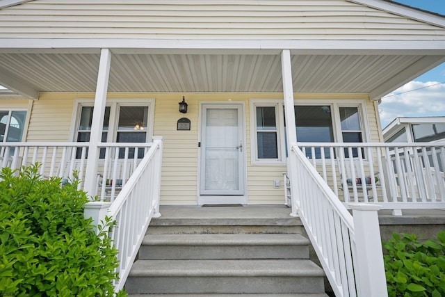 doorway to property featuring covered porch