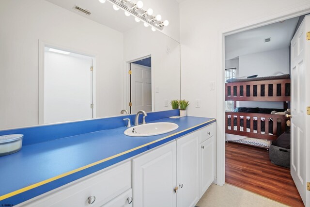104 Van Sant Ave, Linwood, NJ 08221 - bathroom featuring visible vents, wood finished floors, and vanity