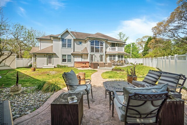 104 Van Sant Ave, Linwood, NJ 08221 - rear view of house with an outdoor living space, a hot tub, a balcony, a fenced backyard, and a patio