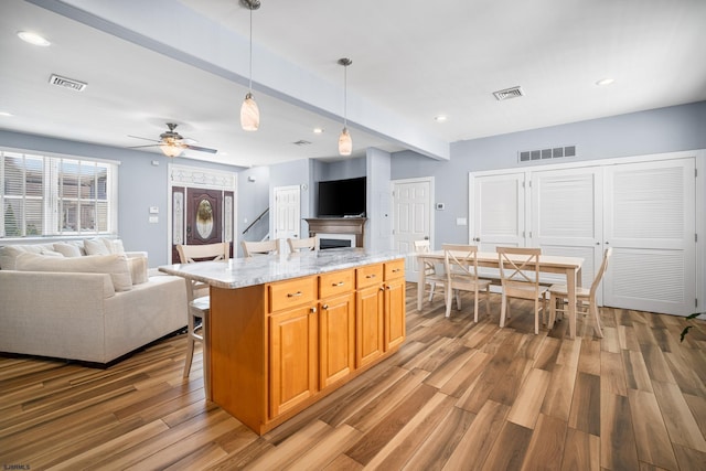 111 N Madison Ave Unit 2, Margate, NJ 08402 - kitchen with open floor plan, visible vents, and wood finished floors