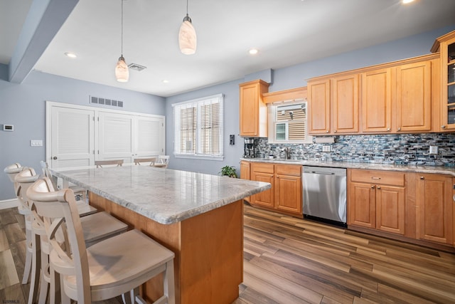 111 N Madison Ave Unit 2, Margate, NJ 08402 - kitchen with backsplash, visible vents, wood finished floors, dishwasher, and a sink
