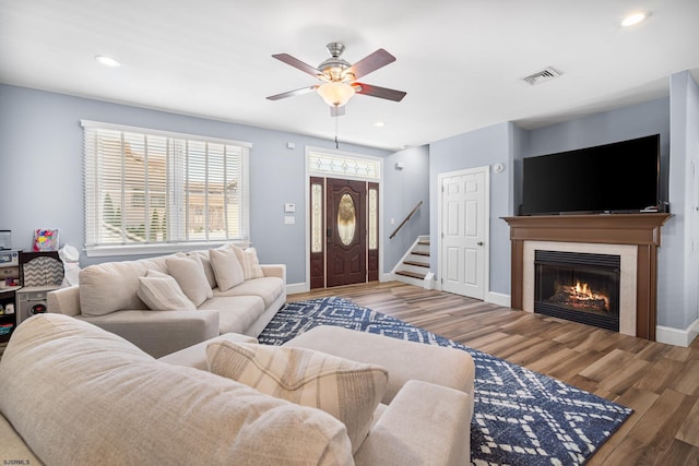 111 N Madison Ave Unit 2, Margate, NJ 08402 - living room featuring a lit fireplace, a ceiling fan, wood finished floors, and visible vents