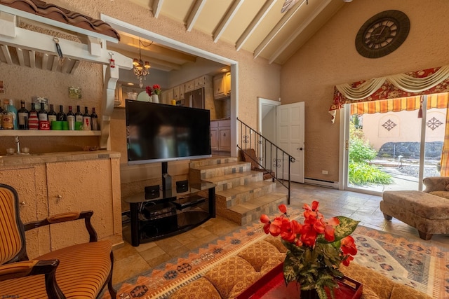 living room featuring beam ceiling, high vaulted ceiling, stairway, a baseboard heating unit, and a notable chandelier