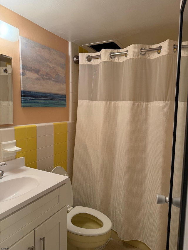 108 S Montpelier Ave Unit 225, Atlantic City, NJ 08401 - bathroom featuring tile walls, vanity, toilet, and curtained shower
