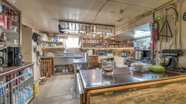 kitchen featuring stainless steel countertops