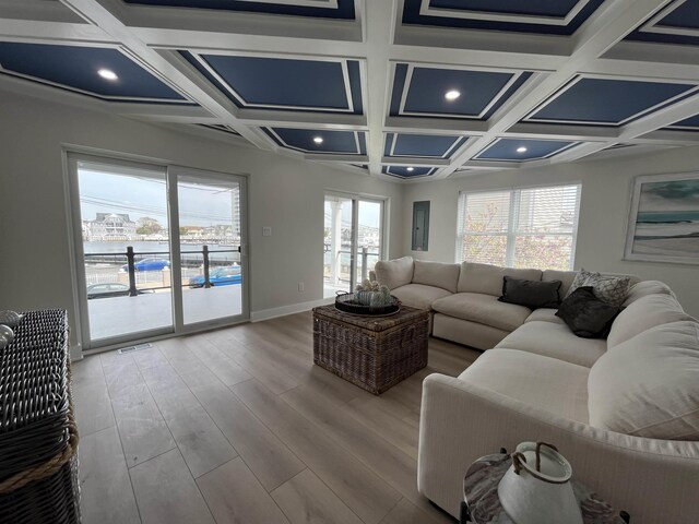 living area featuring wood finished floors, beamed ceiling, baseboards, recessed lighting, and coffered ceiling