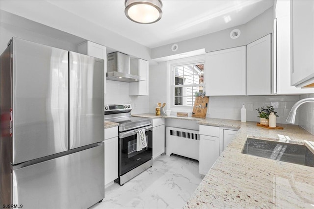 626 1st St, Northfield, NJ 08225 - kitchen with marble finish floor, radiator heating unit, wall chimney exhaust hood, a sink, and appliances with stainless steel finishes
