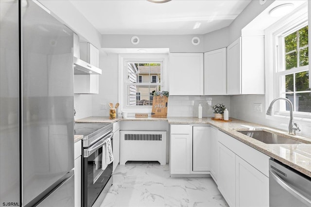 626 1st St, Northfield, NJ 08225 - kitchen featuring plenty of natural light, a sink, radiator, and stainless steel appliances