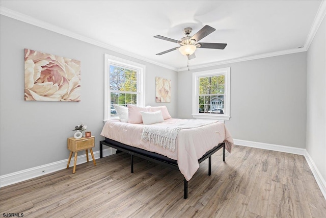 626 1st St, Northfield, NJ 08225 - bedroom featuring light wood-type flooring, ornamental molding, baseboards, and a ceiling fan