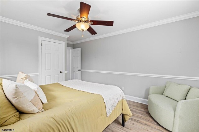 626 1st St, Northfield, NJ 08225 - bedroom with baseboards, ornamental molding, ceiling fan, and wood finished floors