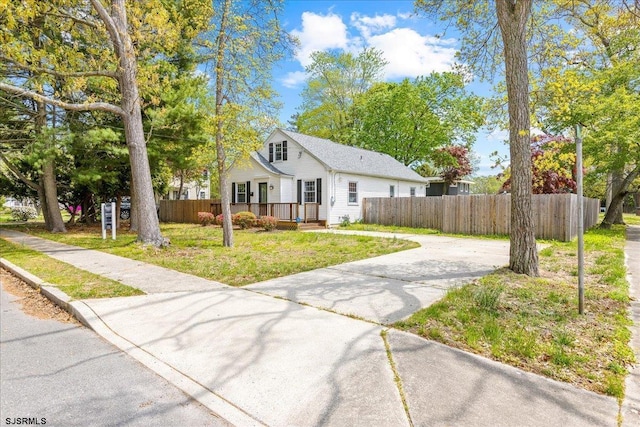 626 1st St, Northfield, NJ 08225 - bungalow-style house with fence private yard, a front lawn, and driveway