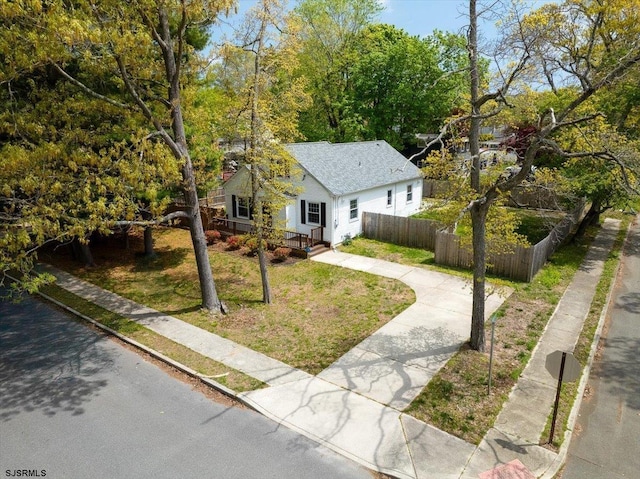 626 1st St, Northfield, NJ 08225 - view of front of home featuring roof with shingles, fence, and a front yard