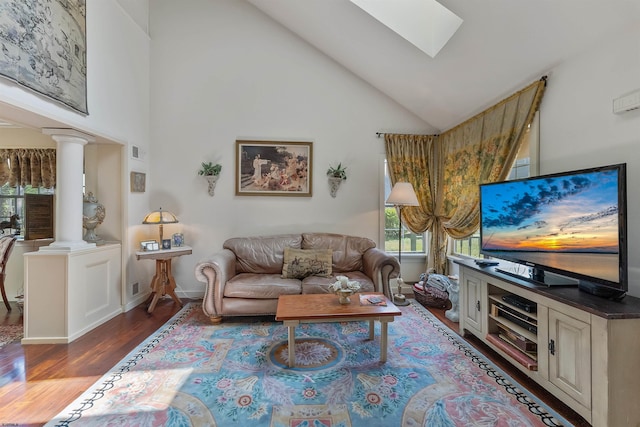 711 Falcon Crest Pl, Smithville, NJ 08205 - living room with high vaulted ceiling, wood finished floors, a skylight, ornate columns, and baseboards