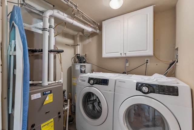 711 Falcon Crest Pl, Smithville, NJ 08205 - clothes washing area with separate washer and dryer, cabinet space, and water heater