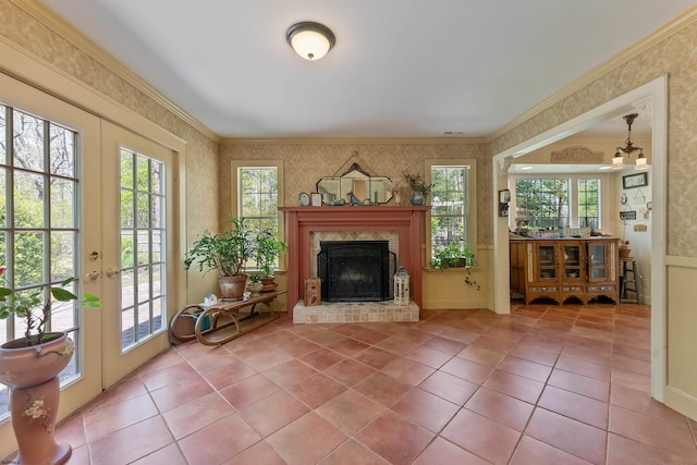 711 Falcon Crest Pl, Smithville, NJ 08205 - living area featuring wallpapered walls, healthy amount of natural light, ornamental molding, a fireplace, and tile patterned floors