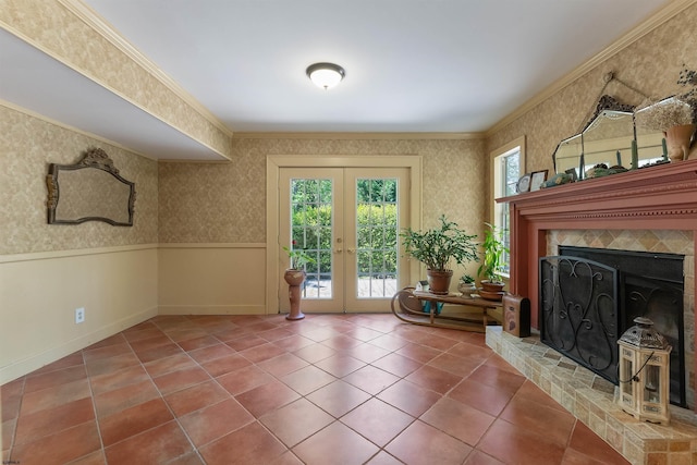 711 Falcon Crest Pl, Smithville, NJ 08205 - unfurnished living room featuring french doors, crown molding, wallpapered walls, tile patterned flooring, and a fireplace with raised hearth