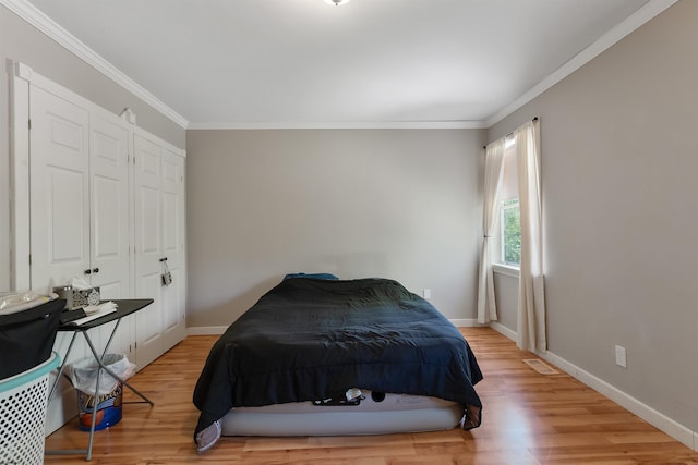 711 Falcon Crest Pl, Smithville, NJ 08205 - bedroom with ornamental molding, wood finished floors, and baseboards